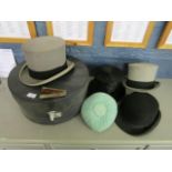 A C A Dunn top hat and a bowler hat, a Locke & Co grey top hat, a Selfridges grey top hat in hat