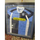 A signed Wycombe Wanderers football shirt, mounted in a glazed frame, frame 36 1/2" x 22 3/8"