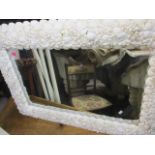 A pair of modern rectangular wall mirrors with shell decorated frames