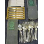 A selection of cutlery to include silver plated butter knives, cased