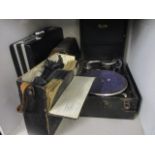 A Maxitone gramophone, together with mixed records and a briefcase