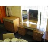 A mid 20th century Limelight chest of drawers together with a matching dressing table and a G-plan