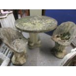 A weathered composition stone garden pedestal table 31"h x 45" dia. and a matching pair of chairs