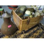 A Wicker hamper containing mixed metalware and other items to include a Middle Eastern copper bottle