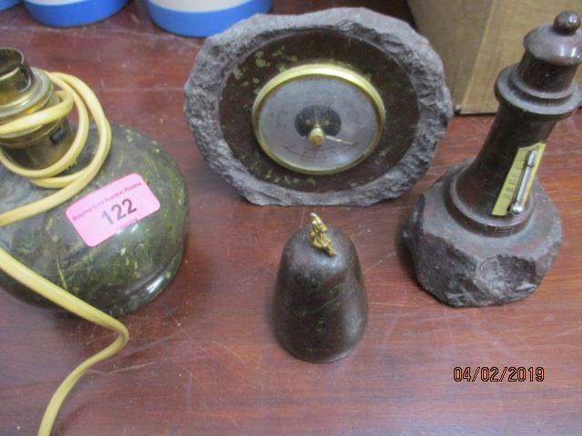 Four pieces of Cornish serpentine stone to include a lamp, a thermometer, a barometer and a