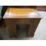 A modern George III design mahogany knee hole desk with seven drawers, 30"h x 29 3/4"w