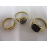 An 18ct gold gentleman's dress ring, together with two 9ct gold gents signet rings, one inset with a