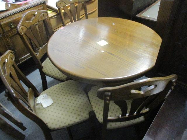 A modern oak breakfast table, 30 1/4"h x 42"w and a set of four dining chairs