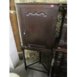 A Georgian oak corner cabinet on a later bobbin turned stand, 71 1/2"h x 29"w