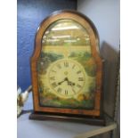 A reproduction decorative mantle clock in a burr yew case, 14 1/2"h