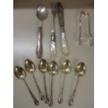 A small quantity of silver flatware and cutlery to include a mother of pearl handled fish knife