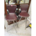 A pair of swivel topped bar stools