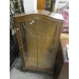 An early 20th century walnut display cabinet