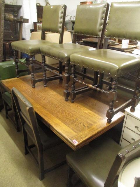 An mid 20th century oak refectory extending draw leaf dining table, 30"h x 57" w, together with