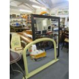 A large modern black framed mirror, together with a painted overmantle mirror