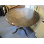 A George III oak circular topped occasional table on three cabriole legs, 29" h x 31" w