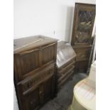 Reproduction oak furniture to include a linenfold drinks cabinet, a bureau and a corner cabinet