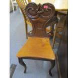 An early Victorian mahogany hall chair