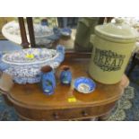 A Portuguese china flower centrepiece, two pieces of Torquay Ware, a pottery bread crock and a