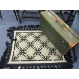 A mid 20th century suitcase and a retro Casa Fino scatter rug, together with a mid 20th century