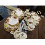 A quantity of Royal Albert Country Roses part tea and dinner service comprising approximately 51