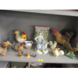 A German ceramic figure of a cobbler and a quantity of ornamental chickens and other items