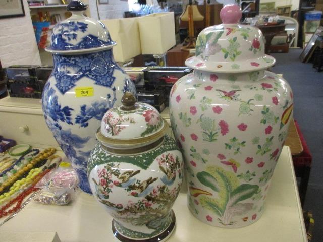 Three mid 20th century oriental vases to include a blue and white Chinese vase with lid