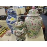 Three mid 20th century oriental vases to include a blue and white Chinese vase with lid