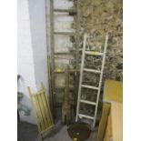 A mixed lot to include a French orchard ladder, a wooden bath rack, a brass rail and other items