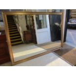 A large modern gilt framed mirror