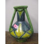 A studio pottery vase of bulbous form with geometric motifs