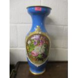 A large late 19th century French vase having blue ground, painted floral decoration and gilt