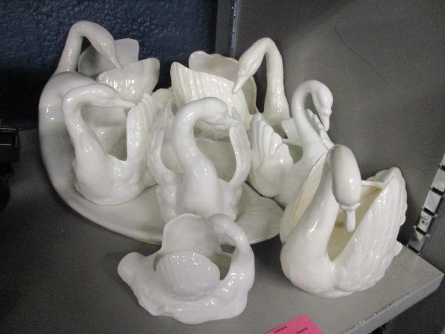 A selection of ceramic swan ornaments to include Staffordshire examples