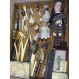 Mixed bone, ebony and ivory glove stretchers, letter openers, button hooks, thimbles, mixed dolls to