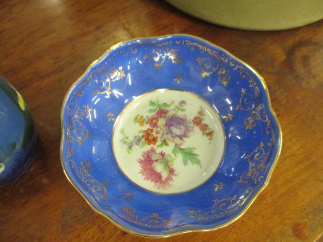 A Portuguese china flower centrepiece, two pieces of Torquay Ware, a pottery bread crock and a - Image 4 of 4