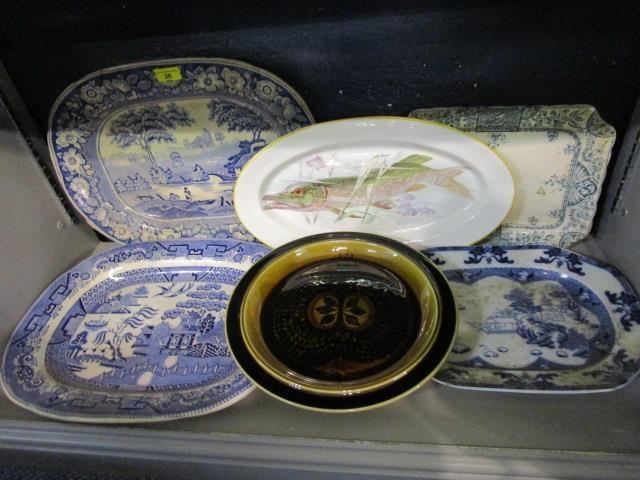 A group of pottery meat plates to include an Arabia plate and a Victorian blue and white meat plate