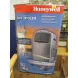 A boxed Honeywell air conditioning unit