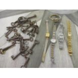 A Guy Laroche ladies wristwatch and others, together with mixed vintage keys