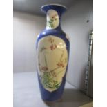 A 19th century powder blue Chinese porcelain vase with floral reserves, 12" h