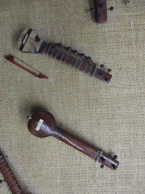 A display of Indian and other miniature wooden musical instrument models - Image 2 of 2