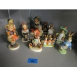 A group of Goebel Hummel figurines and four Beswick Beatrix Potter figures to include Benjamin Bunny