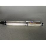 A Mont Blanc Bohme ball point pen, textured stainless steel casing with black highlights, clip