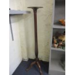 A 1920s mahogany torchere