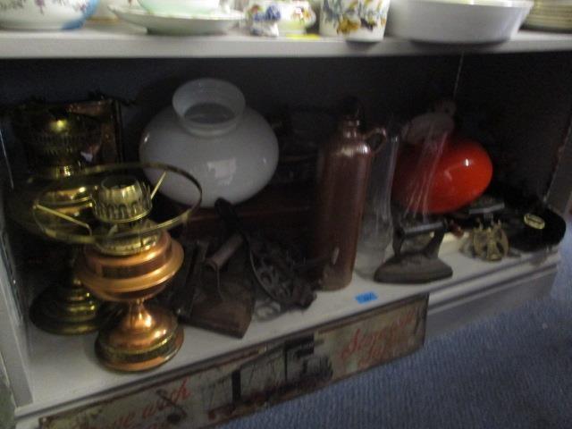 A mixed lot to include a copper and brass oil lamp, a leather briefcase, brass trumpets and other