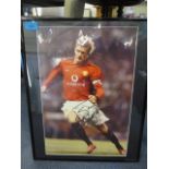 A signed David Beckham picture 18" x 12" framed