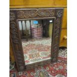 A 1930s carved mirror, 28" x 21"