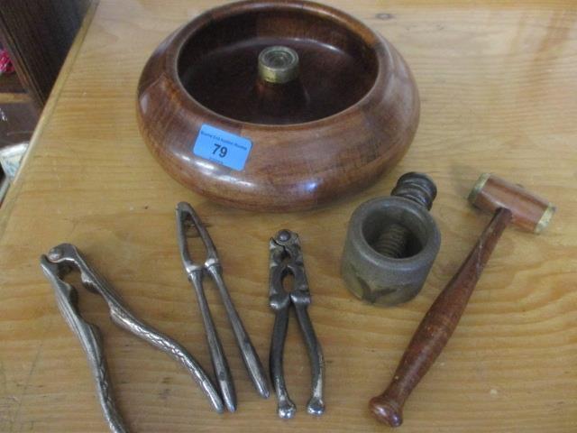 Vintage treen and metal nutcrackers, together with a nut bowl