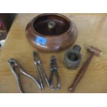 Vintage treen and metal nutcrackers, together with a nut bowl