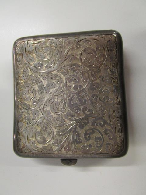 An Edwardian silver cigarette case with floral scrolled decoration, Birmingham 1919, marks for - Image 5 of 10