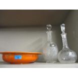 Two cut glass decanters and a Royal Doulton lustre fruit bowl